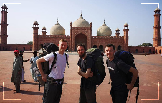 Foreign tourist exploring Badshahi Mosque Lahore Pakistan